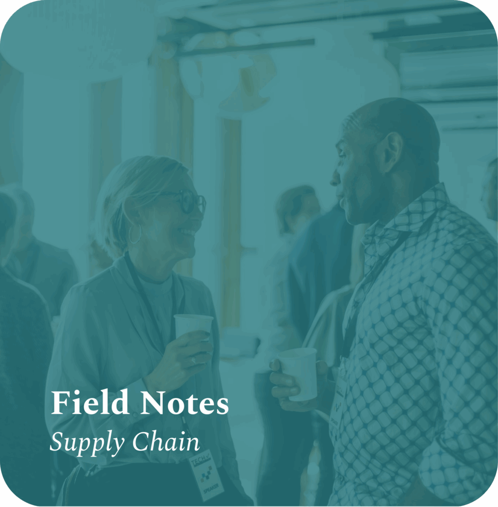 Supply chain executives exchanging insights over coffee