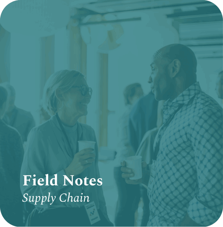 Supply chain executives exchanging insights over coffee